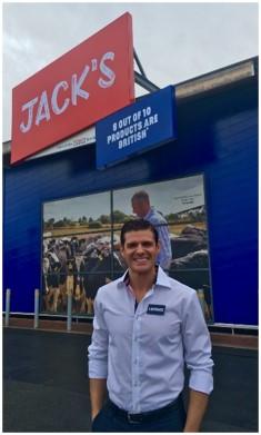 Lawrence Harvey, co author of Triple Jump Trailblazers, standing in front of Jack's, a store he co-founded